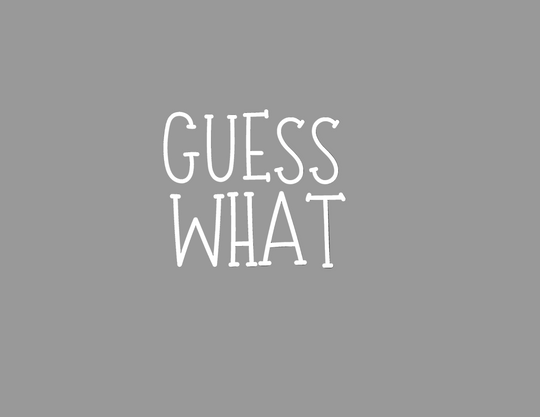 Gray background with 'GUESS WHAT' in white letters on Youth DryBlend® T-Shirt, offering durability, comfort, and eco-friendly features.
