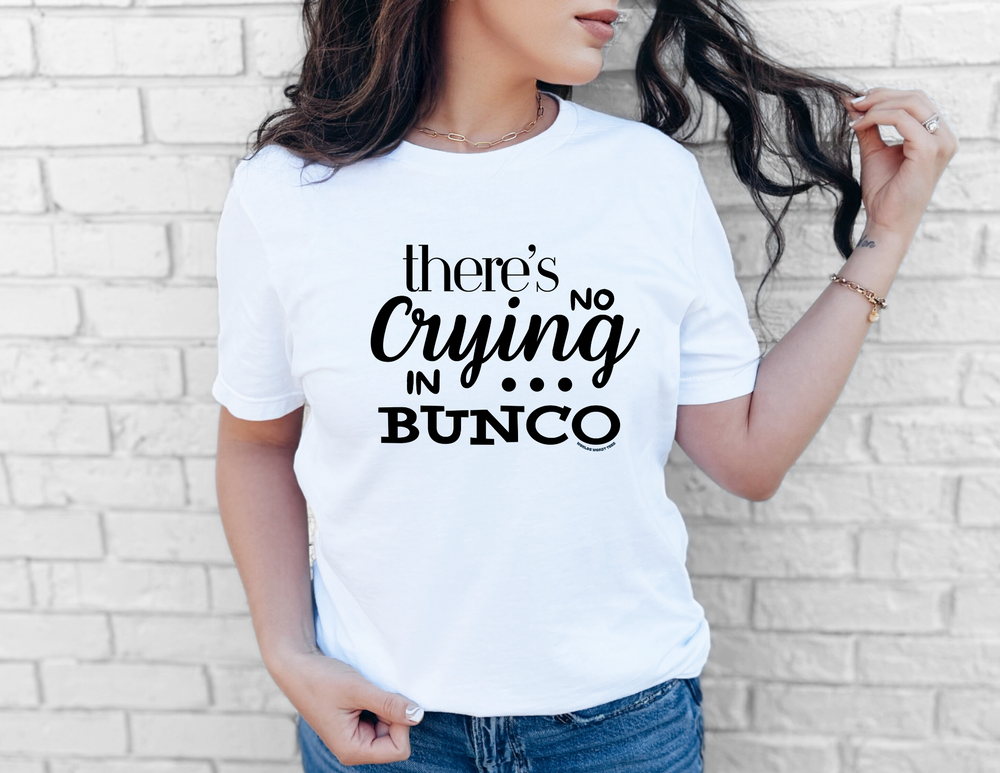 Woman wearing a white No Crying in BUNCO t-shirt from Worlds Worst Tees, showcasing a classic fit with taped shoulders for durability.