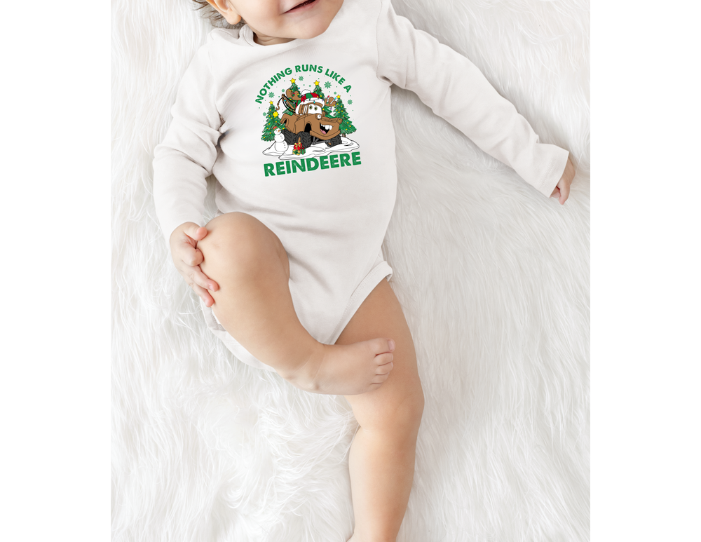 Baby in Reindeere Onesie featuring a festive tow-truck cartoon with Christmas elements, showcasing Faith Family Designs' playful and durable babywear.