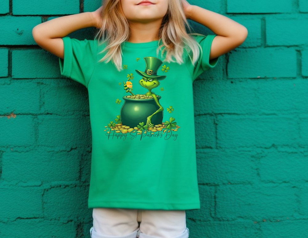 Grinchy St Patrick's Day Toddler's Tee featuring a cartoon green cat and pot of gold, modeled by a girl in a green shirt. Perfect for sensitive skin.