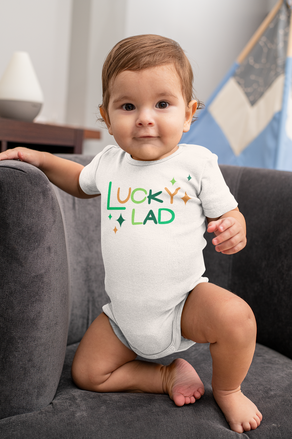 A Lucky Lad Onesie for infants, featuring ring-spun cotton for softness and comfort. Lap shoulders for easy dressing. Unisex fit, light fabric, tear-away label. Ideal for younglings.