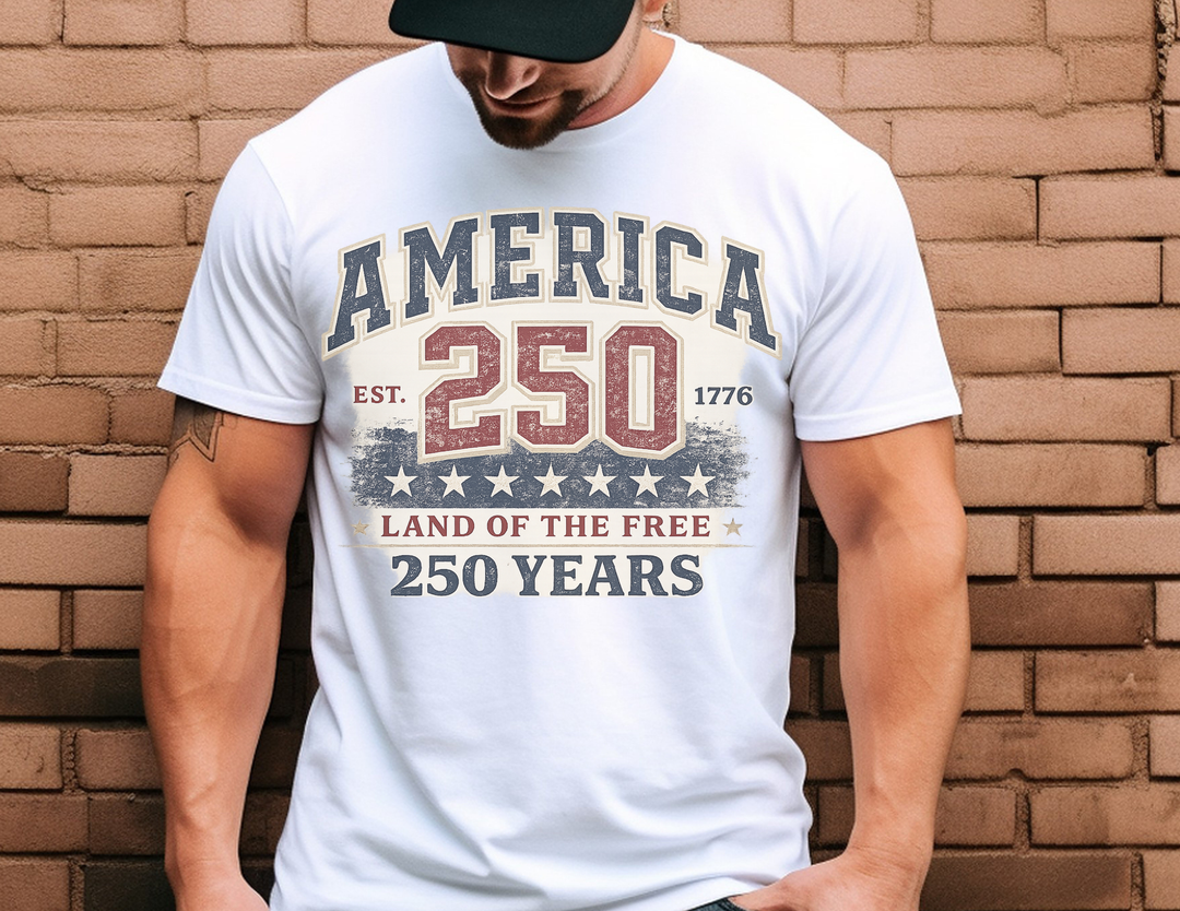 Person wearing the America 250 Years Tee, featuring distressed text and patriotic graphics, celebrating the United States' 250th anniversary.
