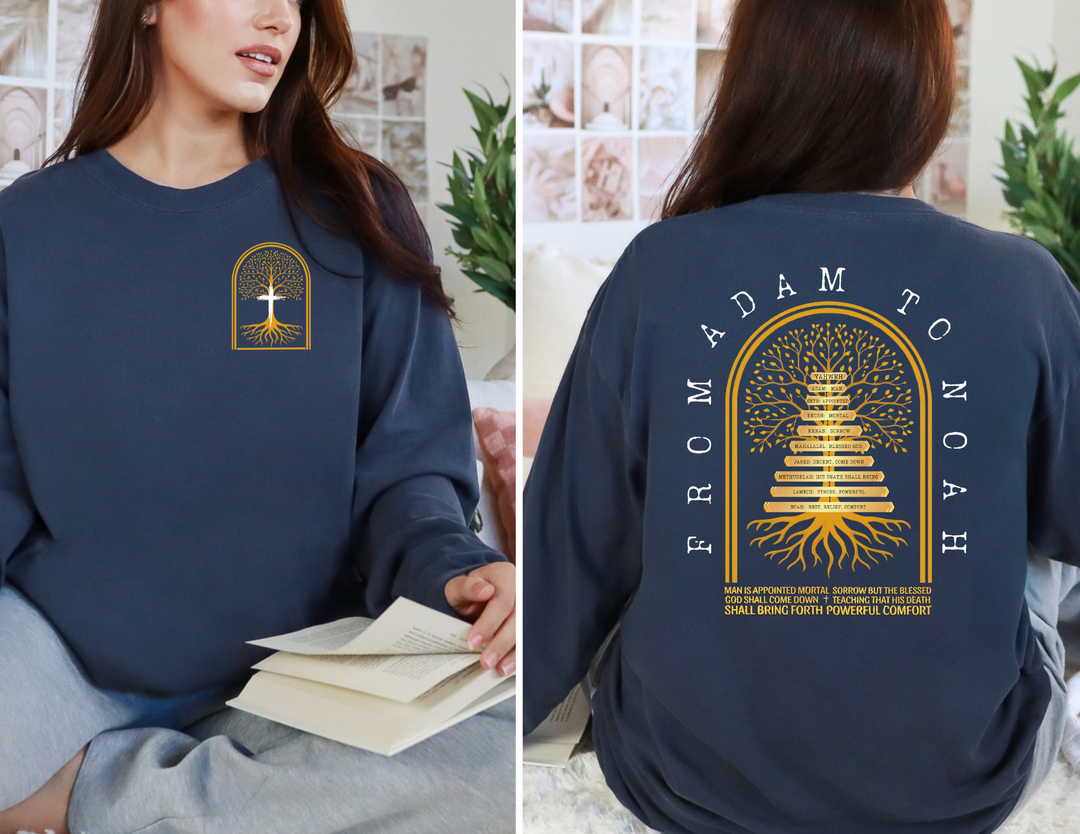 Woman in navy Adam to Noah Tree Long Sleeve T-Shirt with gold and white family-tree design, featuring names of antediluvian patriarchs and biblical text.