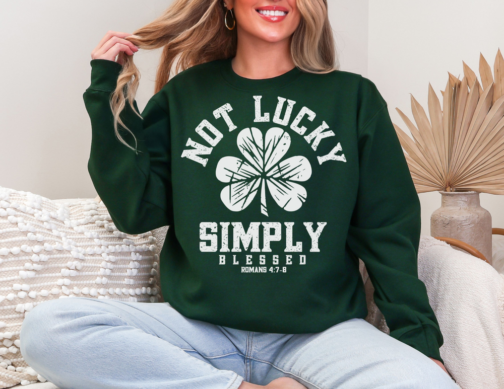 Woman sitting on couch wearing Not Lucky Crew unisex heavy blend sweatshirt, showcasing comfort and style. Ideal for casual settings with ribbed collar and loose fit.