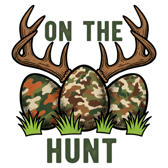 On the Hunt Kids Tee featuring camouflage eggs and antler design, blending Easter fun with hunting humor, perfect for everyday wear.