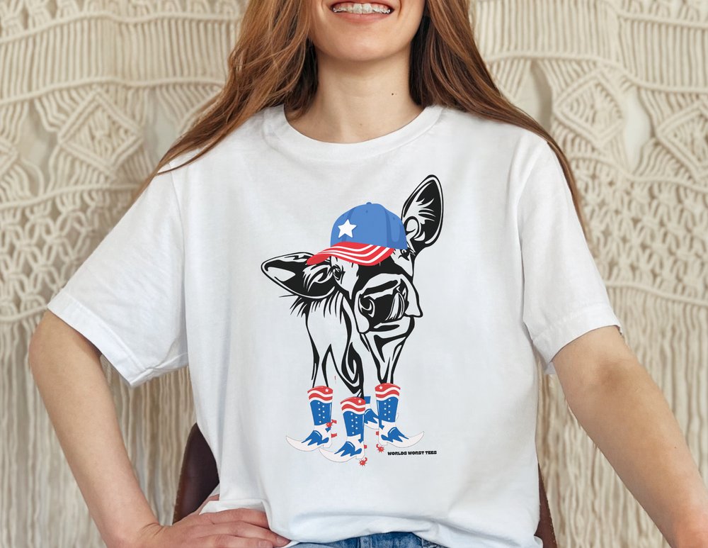 A unisex heavy cotton tee featuring a woman smiling with a cow on a white shirt, embodying casual fashion. No side seams for comfort, tape on shoulders for durability. Perfect for 4th of July Family Rodeo.