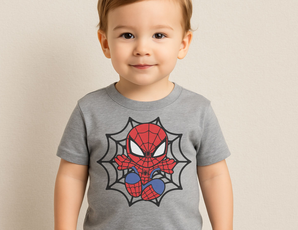 Toddler wearing Spider Kid Baby Tee featuring a cartoonish Spider-Man graphic, showcasing comfort and style. Perfect for early steps with durable, soft cotton fabric.