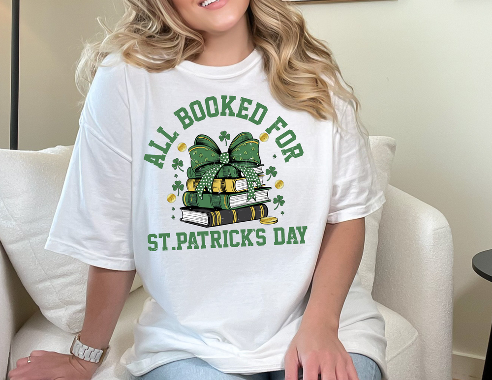 Woman sitting, wearing a Booked for St. Patrick's Day Tee, showcasing a classic unisex jersey fit with soft cotton fabric and ribbed knit collars.