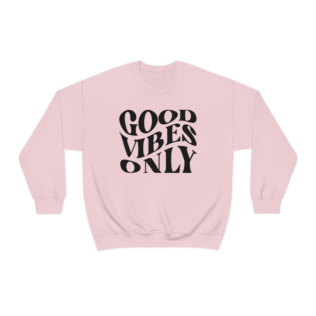 A unisex heavy blend crewneck sweatshirt featuring Good Vibes Only design. Comfortable, loose fit with ribbed knit collar. 50% cotton, 50% polyester, medium-heavy fabric. Sewn-in label, true to size.