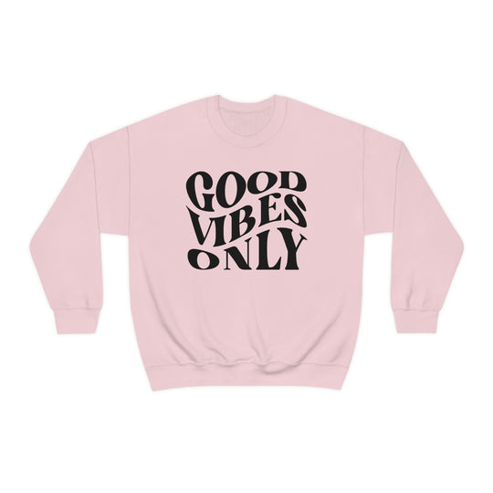 A unisex heavy blend crewneck sweatshirt featuring Good Vibes Only design. Comfortable, loose fit with ribbed knit collar. 50% cotton, 50% polyester, medium-heavy fabric. Sewn-in label, true to size.