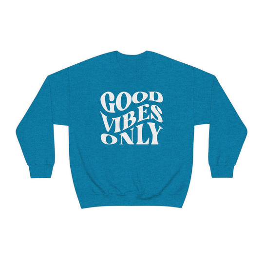 A unisex heavy blend crewneck sweatshirt featuring Good Vibes Only text. Comfortable, loose fit with ribbed knit collar. Made of 50% cotton, 50% polyester. Ideal for everyday wear.