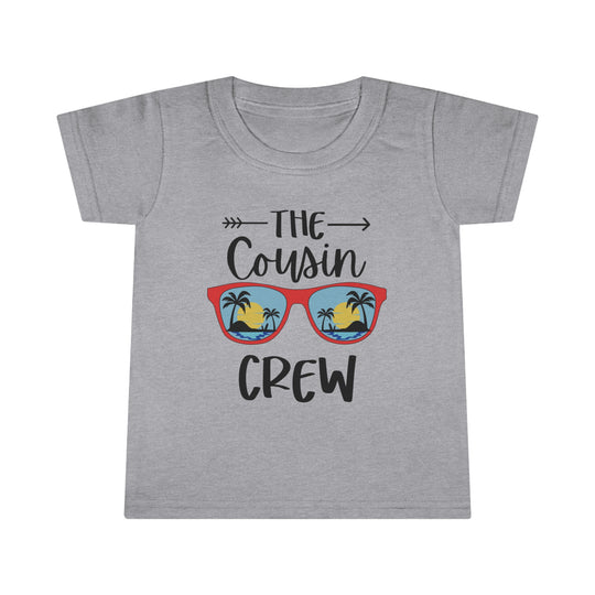 A personalized toddler tee featuring a graphic design of a beach with palm trees. Classic fit for comfort, high stitch density for smooth printing, and durable double-needle collar, sleeve, and bottom hems. Made of 100% Ringspun cotton.
