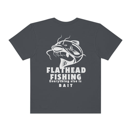Alt text: Flathead Fishing Unisex Tee by Comfort Colors: Back view of a grey shirt with a fish logo and white text. 100% ring-spun cotton, relaxed fit, durable double-needle stitching, seamless design.