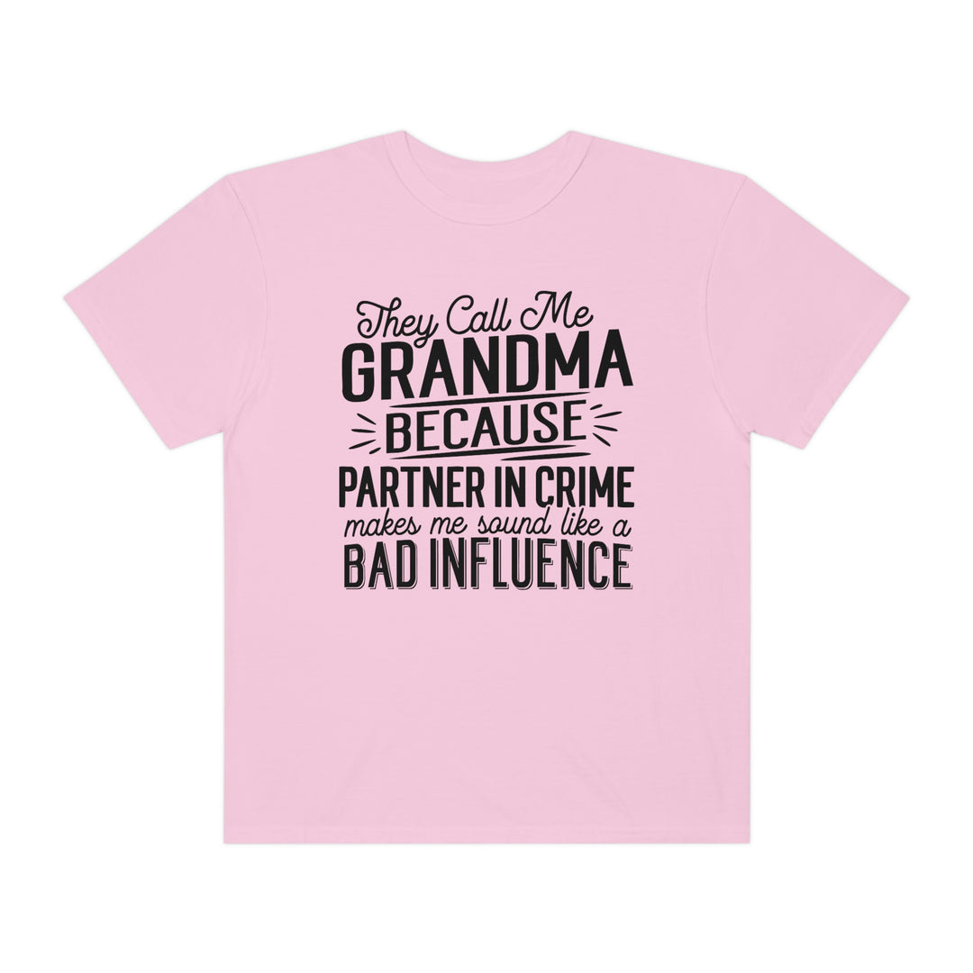 Relaxed fit They Call Me Grandma Tee, pink shirt with black text. 100% ring-spun cotton, garment-dyed for coziness. Durable double-needle stitching, tubular shape. Sizes: S-3XL.