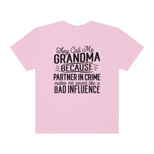 Relaxed fit They Call Me Grandma Tee, pink shirt with black text. 100% ring-spun cotton, garment-dyed for coziness. Durable double-needle stitching, tubular shape. Sizes: S-3XL.