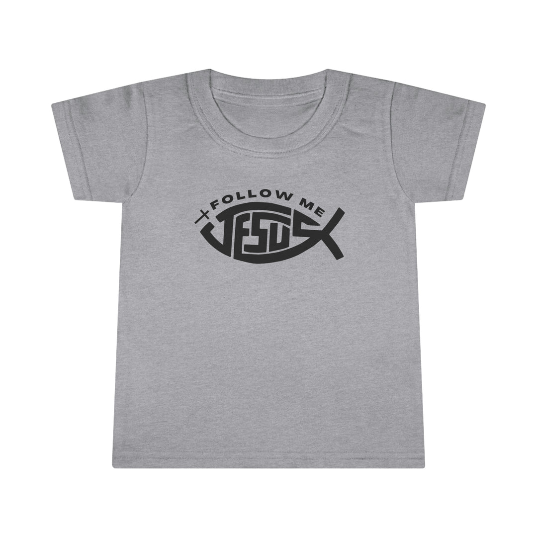 A Jesus Follow Me Toddler Tee with a classic fit and durable design. Features a grey shirt with black text and a graphic logo. Made of 100% Ringspun cotton, 4.5 oz/yd² light fabric.