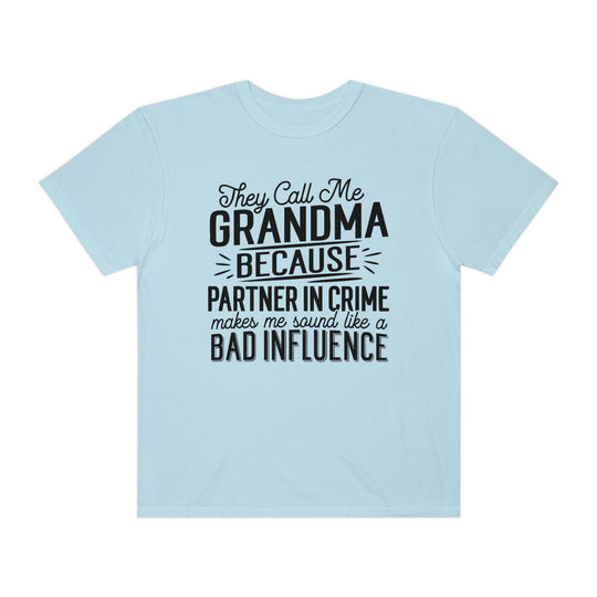 Relaxed fit They Call Me Grandma Tee, light blue with black text. 100% ring-spun cotton, garment-dyed for coziness. Durable double-needle stitching, seamless sides for tubular shape.