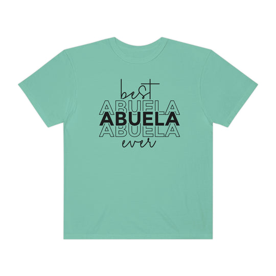A relaxed-fit Best Abuela Ever Tee, crafted from 100% ring-spun cotton. Garment-dyed for extra coziness, featuring double-needle stitching for durability and a seamless design for a tubular shape.