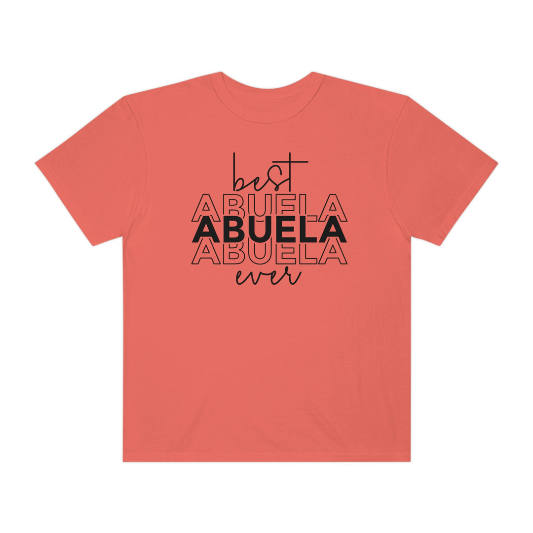 A ring-spun cotton Best Abuela Ever Tee in red with black text. Garment-dyed for coziness, featuring a relaxed fit, double-needle stitching, and no side-seams for durability and shape retention.