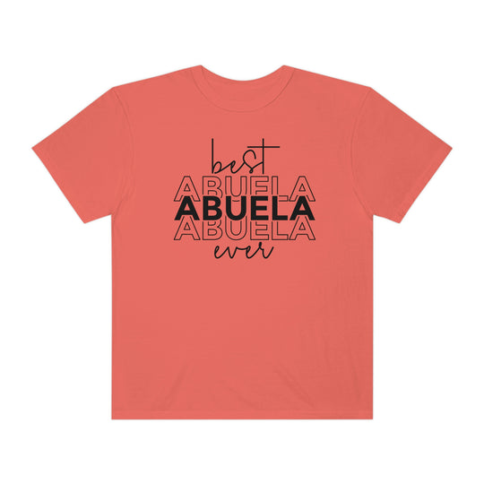 A ring-spun cotton Best Abuela Ever Tee in red with black text. Garment-dyed for coziness, featuring a relaxed fit, double-needle stitching, and no side-seams for durability and shape retention.