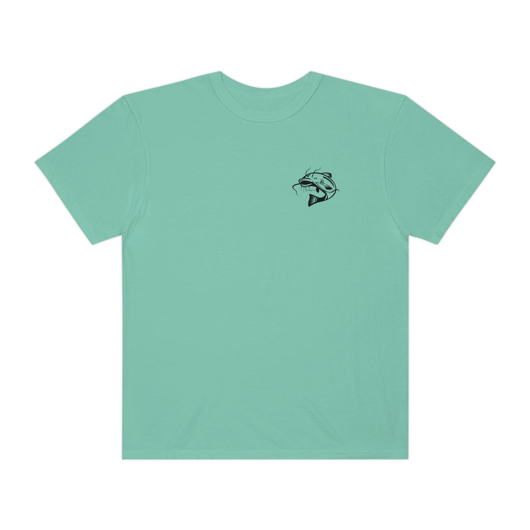 Comfort Colors Flathead Fishing Unisex Tee: 100% ring-spun cotton, relaxed fit, durable double-needle stitching, tubular shape. Green tee with fish logo.