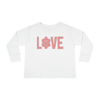 A Love Toddler Long Sleeve Tee crafted from 100% cotton, featuring pink lettering and a flower design. Perfect for active kids with a durable ribbed collar and shoulder-to-shoulder taping for comfort.