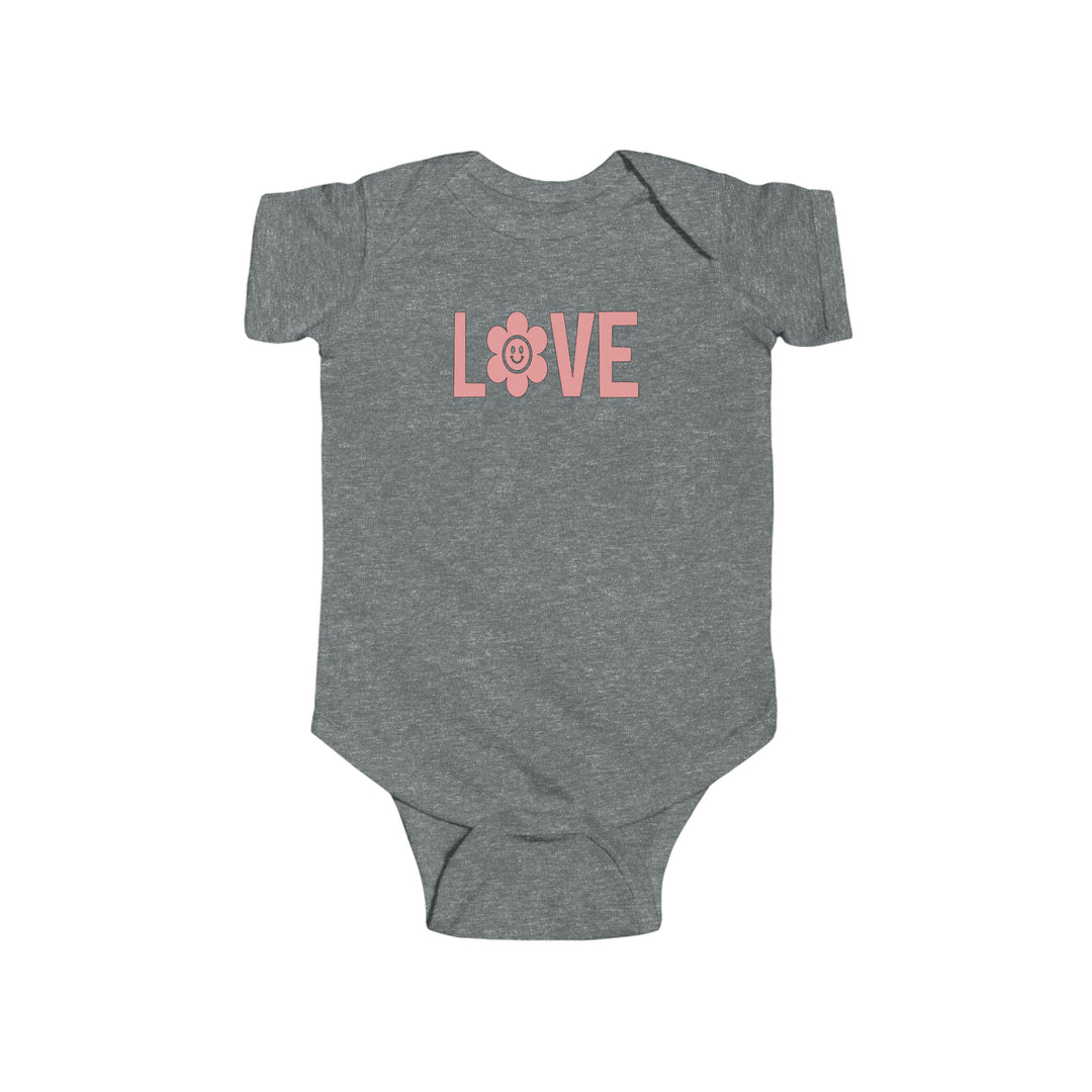 A grey baby bodysuit with pink text and a cute design, ideal for infants. Made of soft 100% cotton fabric with ribbed knitting for durability. Features plastic snaps for easy changing. From Worlds Worst Tees.