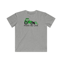 A playful Pushin My Luck Kids Tee featuring a tractor design on soft cotton fabric. Youth style tee with a regular fit and quality construction. Ideal for kids who love unique graphic t-shirts.