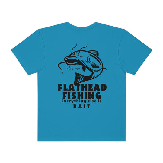 Alt text: Flathead Fishing Unisex Tee by Comfort Colors, featuring a fish and text design on a blue shirt. 100% ring-spun cotton, relaxed fit, durable double-needle stitching, and seamless construction for ultimate comfort.