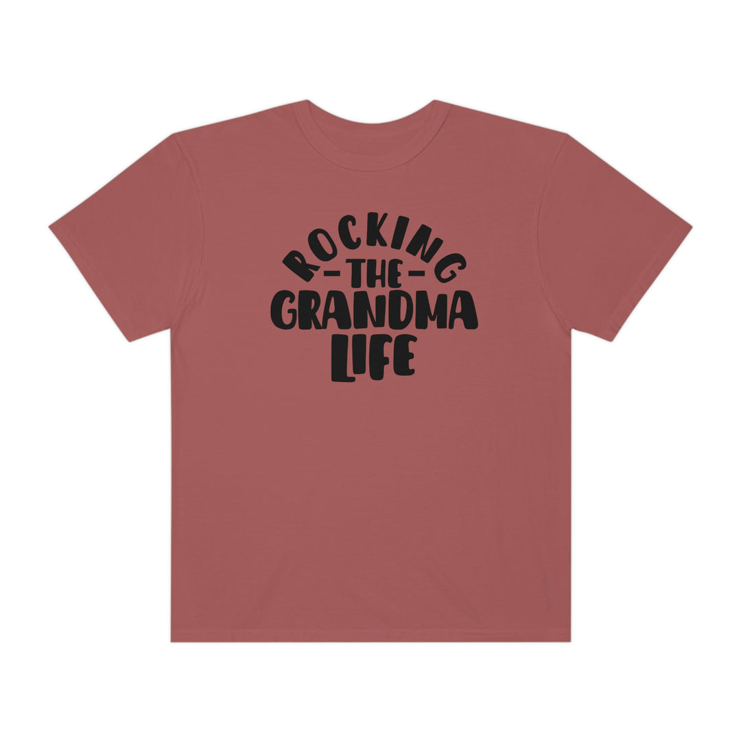 Rocking the Grandma Life Tee: 100% ring-spun cotton t-shirt with a relaxed fit. Garment-dyed for extra coziness, double-needle stitching for durability, and seamless design for a tubular shape. Sizes S to 3XL.