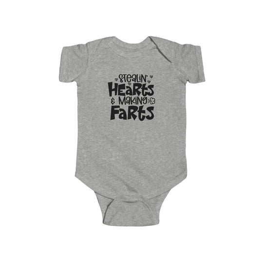 A durable and soft infant fine jersey bodysuit, the Stealin Hearts and Making Farts onesie features 100% cotton fabric, ribbed knitting for durability, and plastic snaps for easy changes. From Worlds Worst Tees.