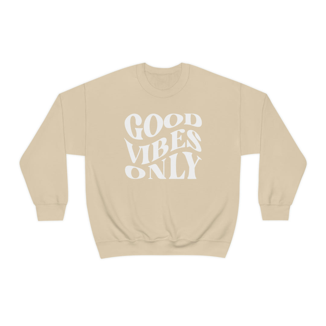 A cozy unisex Good Vibes Only crewneck sweatshirt in beige with white text. Polyester-cotton blend, ribbed knit collar, no itchy side seams. Medium-heavy fabric, loose fit, sewn-in label.