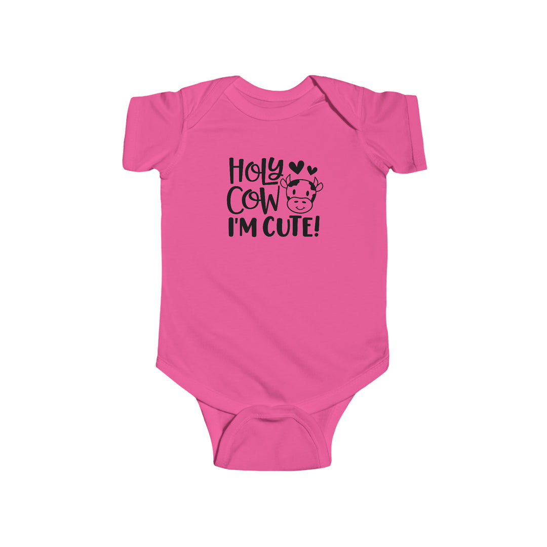 Infant pink romper with black cow face text. 100% cotton, durable seams, ribbed bindings, plastic snaps for easy changing. Title: Holy Cow I'm Cute Onesie. Brand: Worlds Worst Tees.
