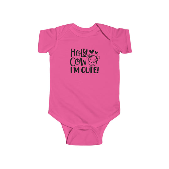 Infant pink romper with black cow face text. 100% cotton, durable seams, ribbed bindings, plastic snaps for easy changing. Title: Holy Cow I'm Cute Onesie. Brand: Worlds Worst Tees.