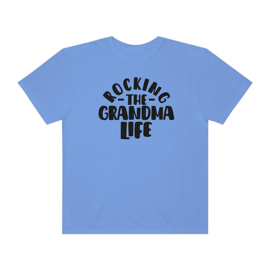 Rocking the Grandma Life Tee: A blue shirt with black text, 100% ring-spun cotton, medium weight, relaxed fit, durable double-needle stitching, and seamless design for ultimate comfort from Worlds Worst Tees.