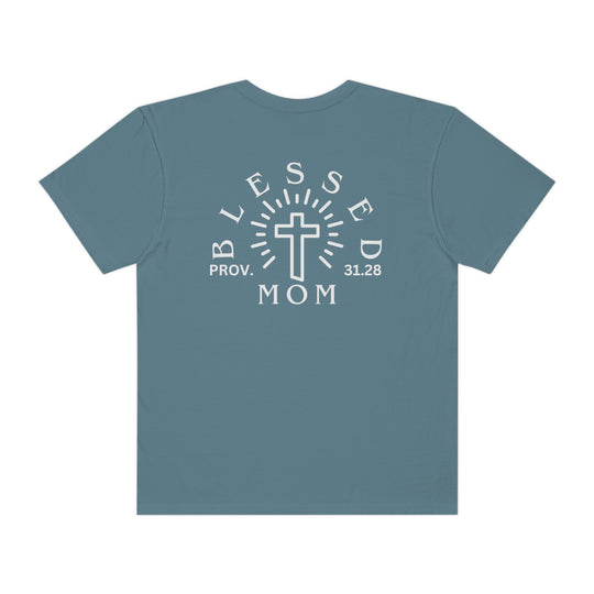 Blessed Mom Tee: Back view of a blue shirt with white text, featuring a cross design. Made of 100% ring-spun cotton, garment-dyed for extra softness. Relaxed fit, double-needle stitching for durability, and seamless sides for a sleek look.