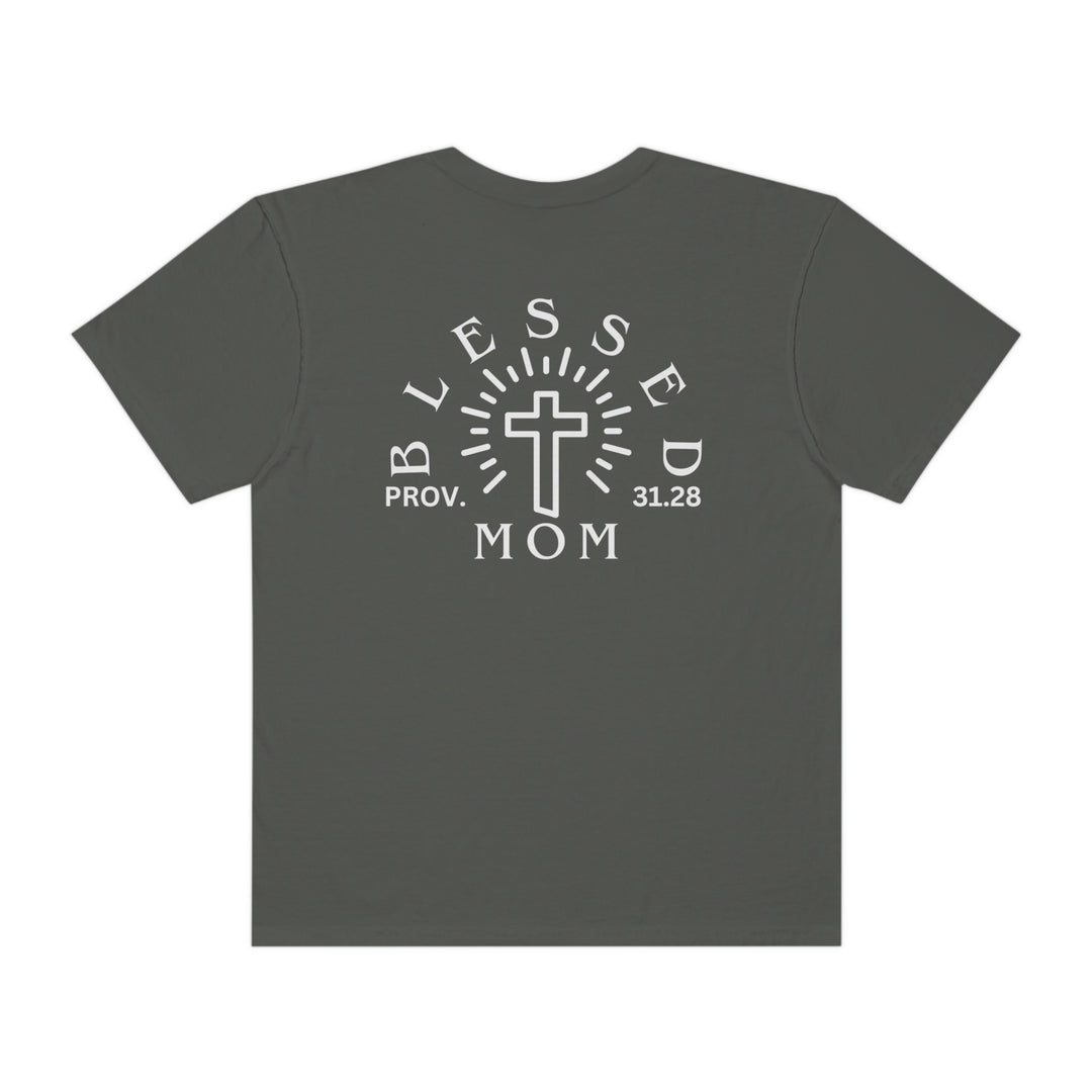 Blessed Mom Tee: Back view of a grey shirt with a white cross and text. 100% ring-spun cotton, garment-dyed for extra coziness. Medium weight, relaxed fit, durable double-needle stitching. No side-seams for a tubular shape.