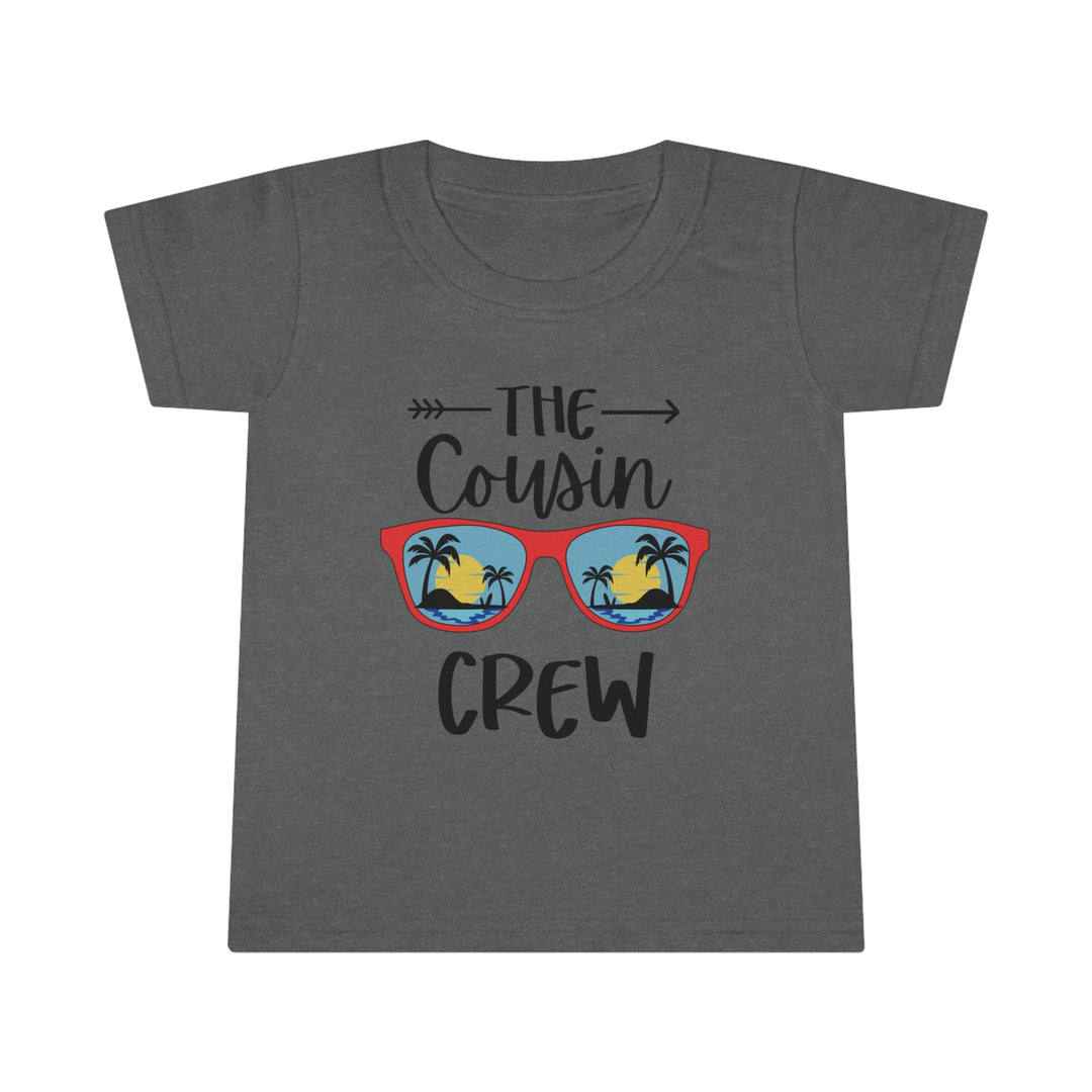 Cousin Crew Toddler Tee featuring a beach and palm tree design on a grey shirt. Classic fit, 100% Ringspun cotton, 3/4 double-needle collar, and double-needle hems for durability. Ideal for personalized prints.
