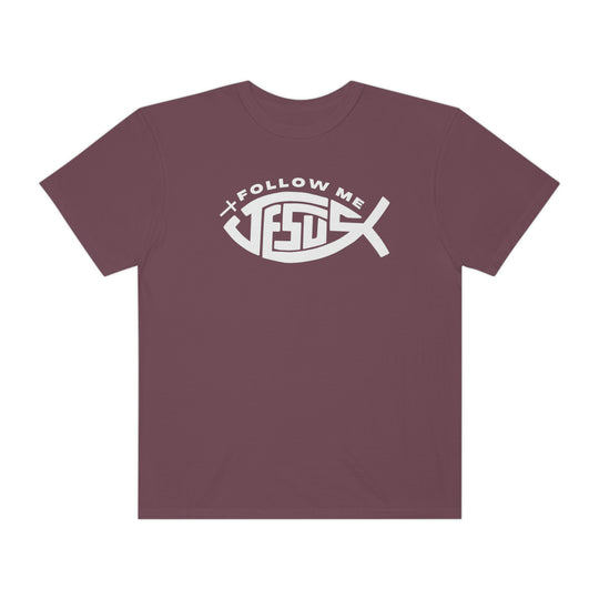 Relaxed fit Jesus Follow Me Tee, purple with fish design. 100% ring-spun cotton, garment-dyed for coziness. Durable double-needle stitching, no side-seams for a tubular shape.