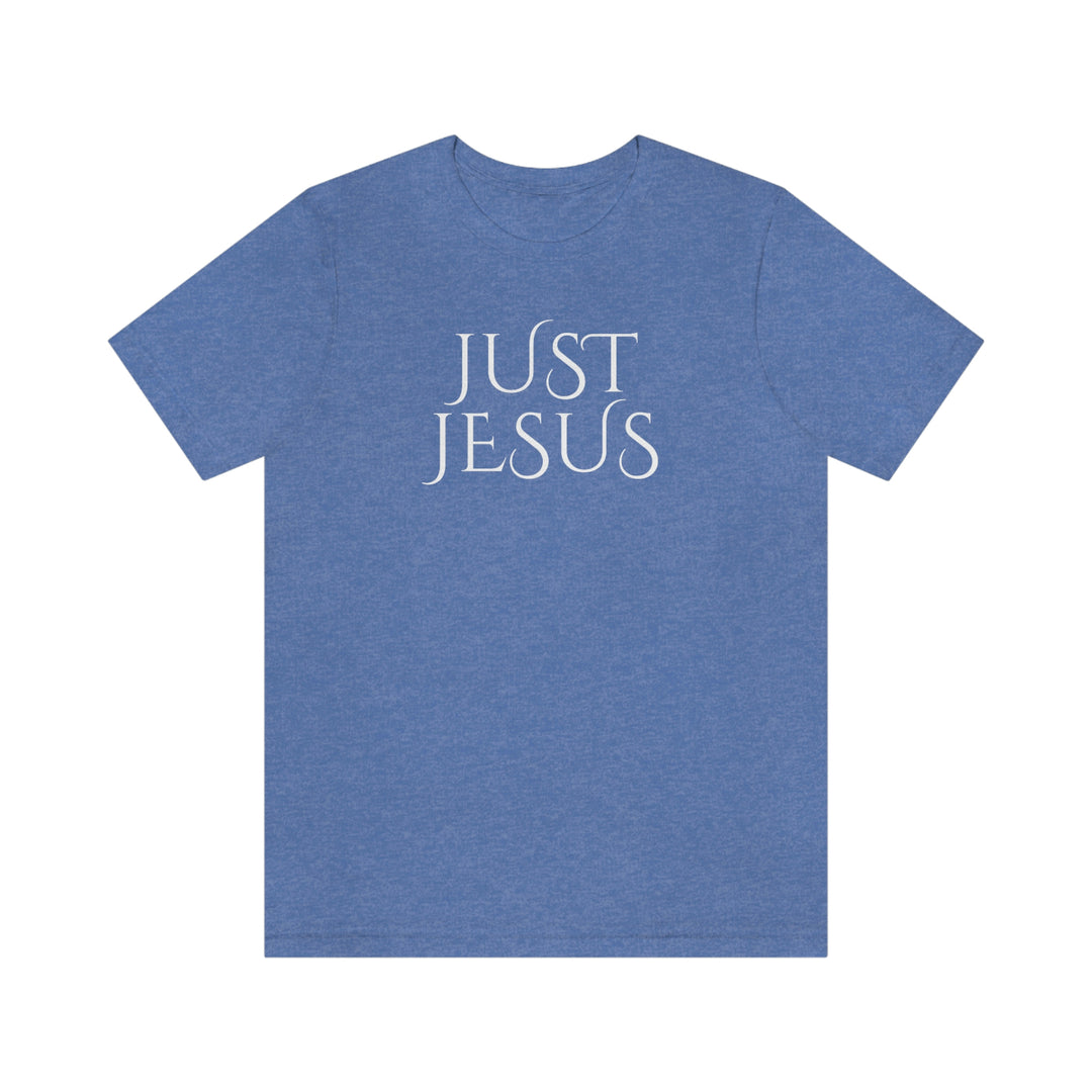 A beloved Just Jesus Tee in blue with white text, featuring a classic unisex jersey design. Made of soft cotton, with ribbed knit collars and taping for lasting fit. 100% Airlume combed and ringspun cotton.