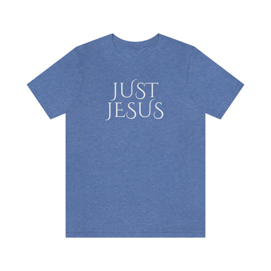 A beloved Just Jesus Tee in blue with white text, featuring a classic unisex jersey design. Made of soft cotton, with ribbed knit collars and taping for lasting fit. 100% Airlume combed and ringspun cotton.
