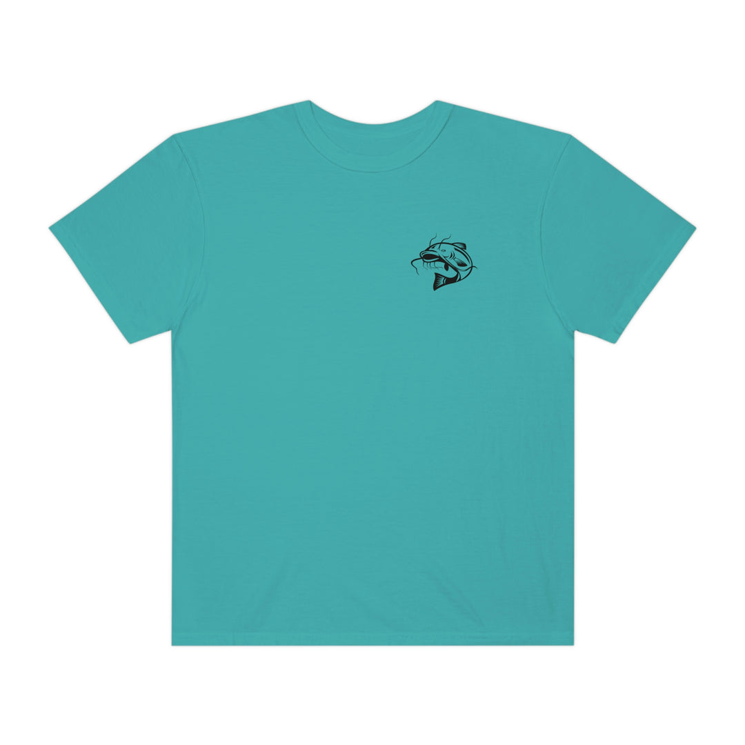 Unisex Flathead Fishing Tee by Comfort Colors: A blue shirt featuring a fish logo, 100% ring-spun cotton, relaxed fit, and durable double-needle stitching. Perfect for everyday comfort.