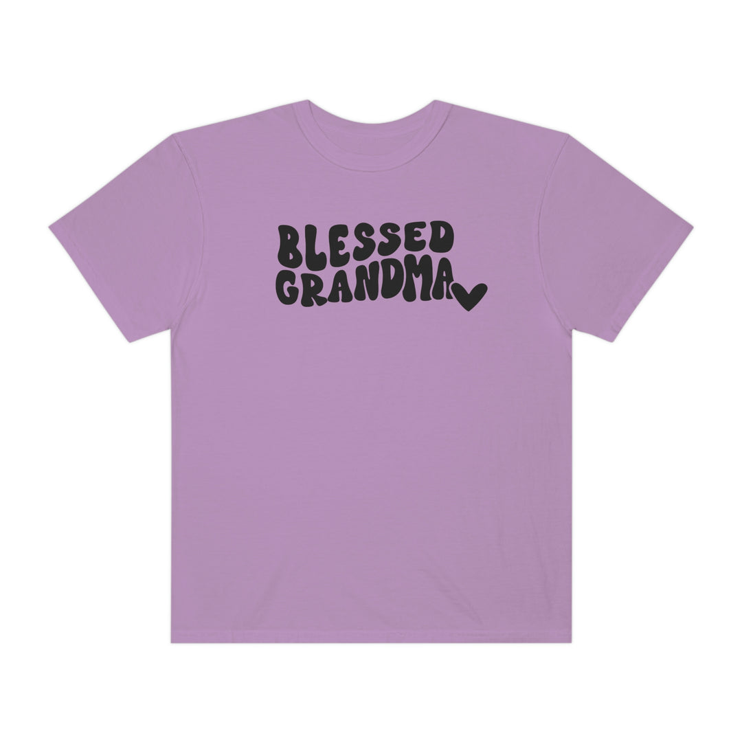 Blessed Grandma Tee: Purple shirt with black text. 100% ring-spun cotton, garment-dyed for coziness. Relaxed fit, durable double-needle stitching, no side-seams for tubular shape. Sizes: S-3XL.