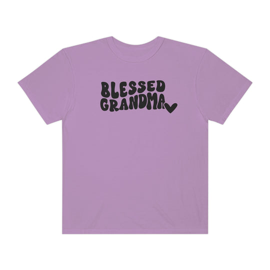 Blessed Grandma Tee: Purple shirt with black text. 100% ring-spun cotton, garment-dyed for coziness. Relaxed fit, durable double-needle stitching, no side-seams for tubular shape. Sizes: S-3XL.