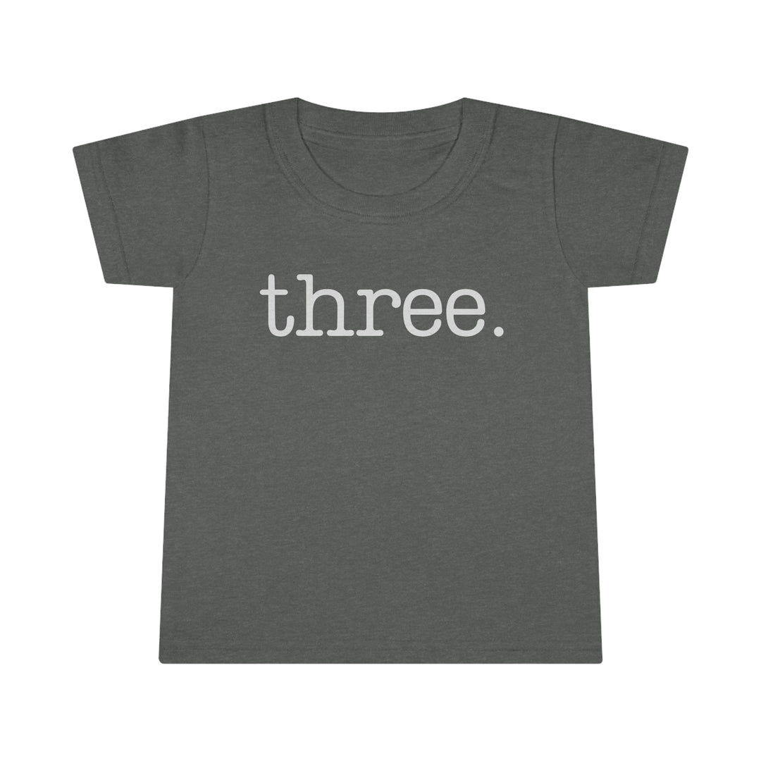 A durable Three Toddler Tee in grey with white text from Worlds Worst Tees. Classic fit, high stitch density, double-needle collar, sleeves, and hems. Made of 100% Ringspun cotton, light fabric.