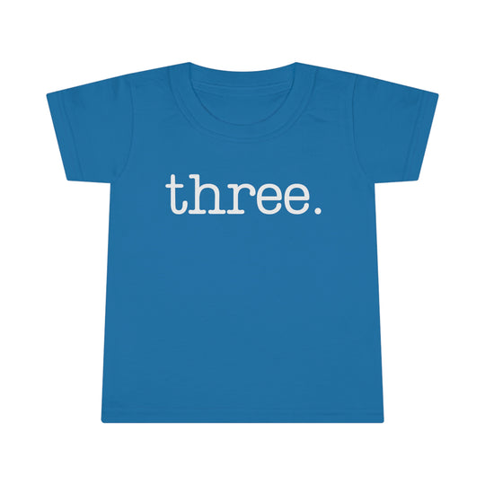 Three Toddler Tee with classic fit and high stitch density. Features 3/4 double-needle topstitched collar, double-needle sleeve, and bottom hems for durability. Made of 100% Ringspun cotton. Light fabric, Classic Fit.