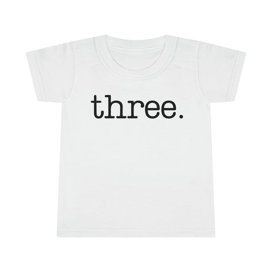 A durable Three Toddler Tee with a classic fit, featuring high stitch density and double-needle topstitched collar and hems. Made of 100% Ringspun cotton, light fabric, perfect for kids.