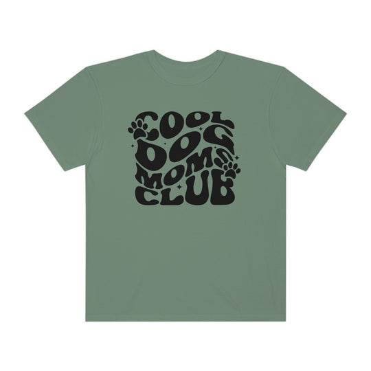 A relaxed fit Cool Dog Mom's Club tee in green with black text, made of 100% ring-spun cotton for extra coziness. Double-needle stitching and seamless design ensure durability and comfort.