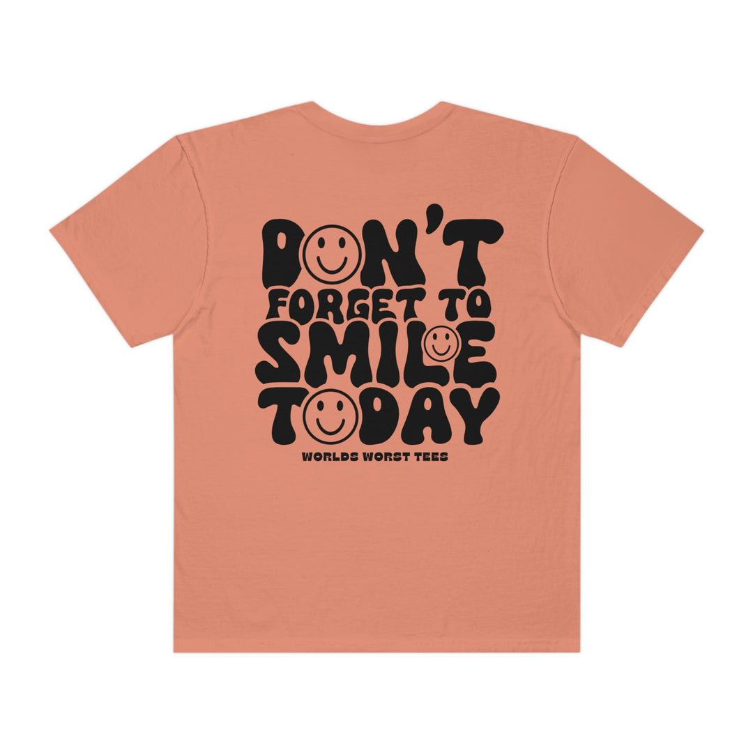 A relaxed fit, garment-dyed t-shirt with a smiley face design on the back. Made of 100% ring-spun cotton for coziness and durability. From Worlds Worst Tees.