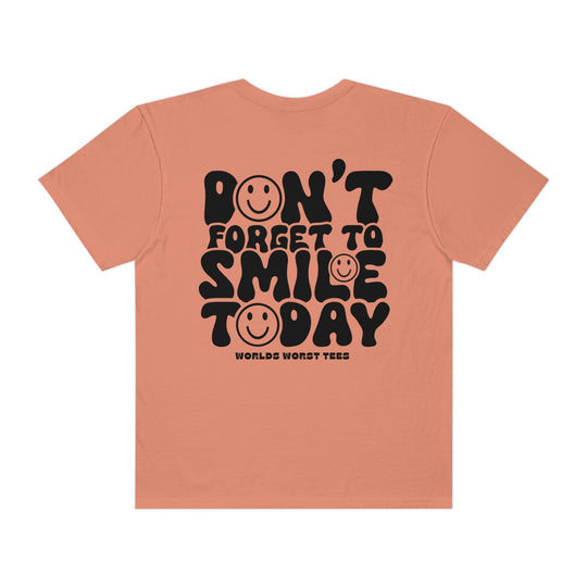A relaxed fit, garment-dyed t-shirt with a smiley face design on the back. Made of 100% ring-spun cotton for coziness and durability. From Worlds Worst Tees.